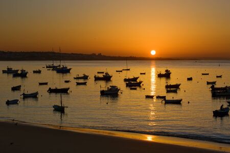 Moored boats at dawn in Portugalの写真素材