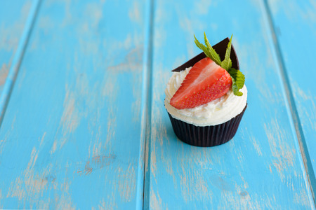 Tasty cake with strawberry on a wooden tableの写真素材