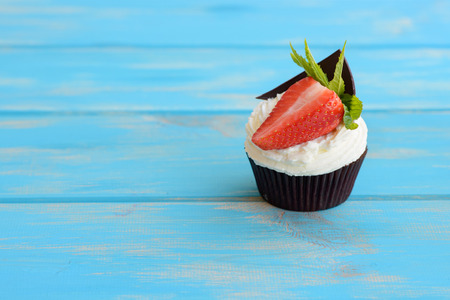 Tasty cake with strawberry on a wooden tableの写真素材