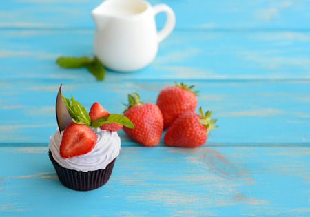 Tasty cake with strawberry on a wooden tableの写真素材