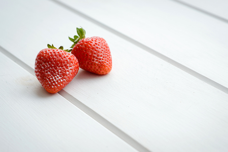 Tasty strawberry on a white tableの写真素材