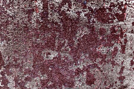 Wall fragment with scratches and cracks