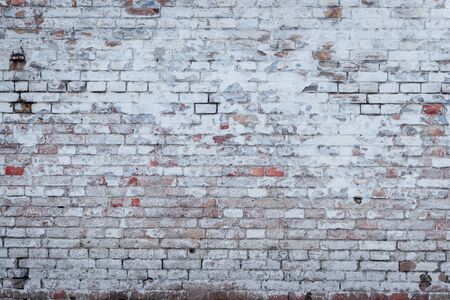 Brick texture with scratches and cracksの写真素材