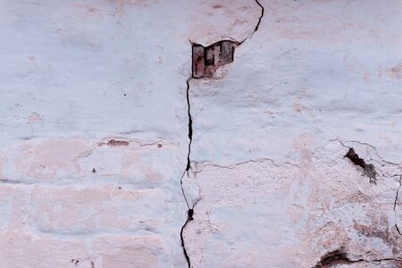 Brick texture with scratches and cracksの写真素材