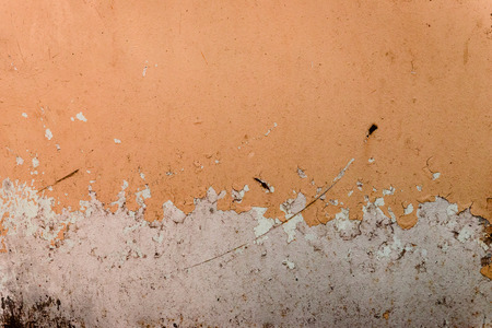 Wall fragment with scratches and cracksの写真素材