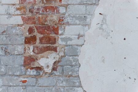 Brick texture with scratches and cracksの写真素材