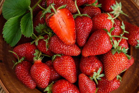 Tasty strawberry on a wooden table. It can be used as a backgroundの写真素材