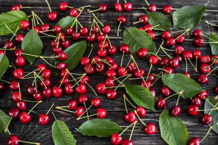 Tasty juicy sweet cherry on a wooden background.の写真素材