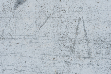 Wall fragment with scratches and cracks. It can be used as a backgroundの写真素材