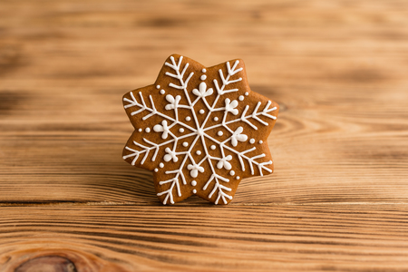 Christmas homemade gingerbread cookies on a wooden table. It can be used as a backgroundの写真素材