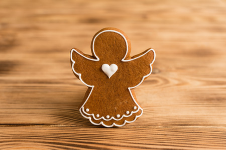 Christmas homemade gingerbread cookies on a wooden table. It can be used as a backgroundの写真素材