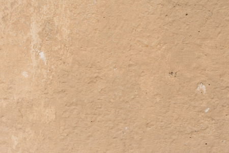 Wall fragment with scratches and cracks. It can be used as a backgroundの写真素材