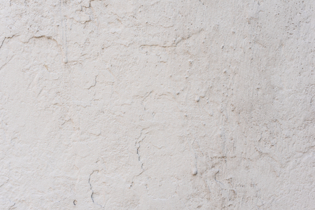 Wall fragment with scratches and cracks. It can be used as a backgroundの写真素材
