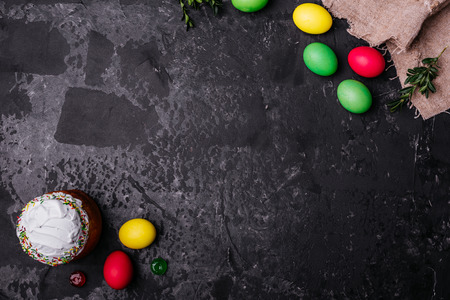 Easter, cake, eggs, holiday. Easter cake and colorful eggs on a dark background. It can be used as a...