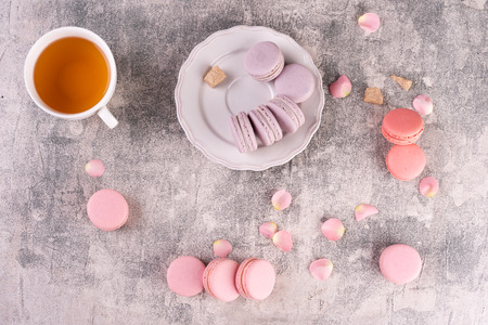 Wedding, St. Valentine's Day, birthday, preparation, holiday. Beautiful pink tasty macaroons on a concrete backgroundの写真素材