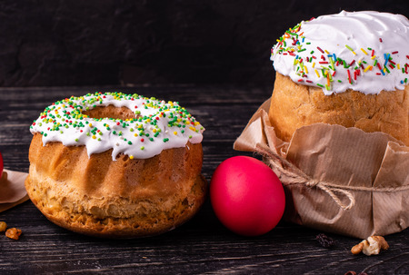 Easter, cake, eggs, holiday. Easter cake and colorful eggs on a dark background. It can be used as a...