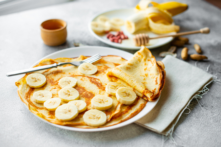 Tasty beautiful pancakes with honeyの写真素材