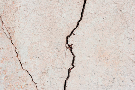 Wall fragment with scratches and cracks