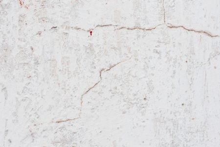 Wall fragment with scratches and cracksの写真素材