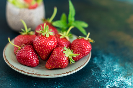Beautiful strawberry and seeds of a chia. A fresh pudding for breakfastの写真素材