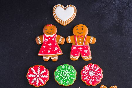 Christmas homemade gingerbread cookies on a dark background