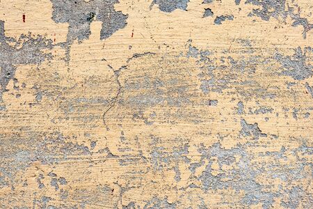 Texture of a concrete wall with cracks and scratches which can be used as a background