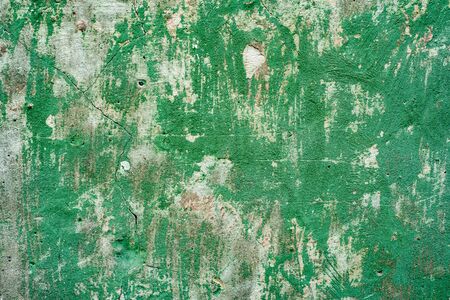 Texture of a concrete wall with cracks and scratches which can be used as a backgroundの写真素材