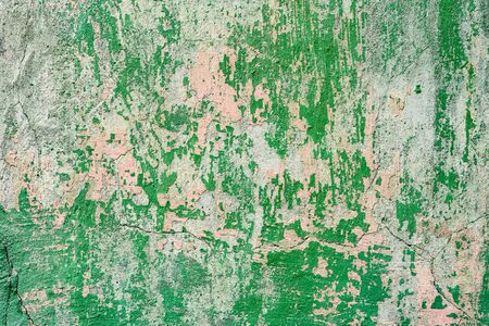 Texture of a concrete wall with cracks and scratches which can be used as a background
