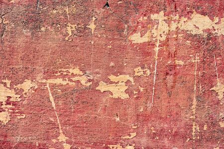 Texture of a concrete wall with cracks and scratches which can be used as a background
