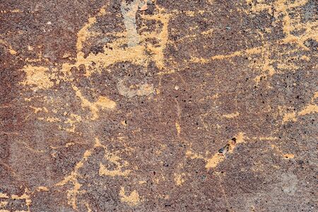 Texture of a concrete wall with cracks and scratches which can be used as a backgroundの写真素材