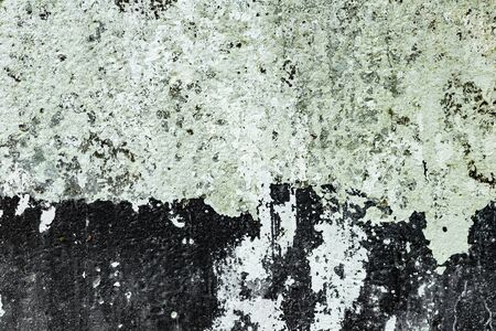 Texture of a concrete wall with cracks and scratches which can be used as a backgroundの写真素材