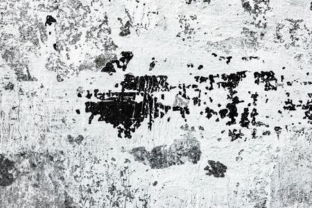 Texture of a concrete wall with cracks and scratches which can be used as a backgroundの写真素材