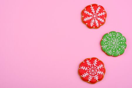 Christmas homemade gingerbread cookies on a bright colored background. New Year discount sale