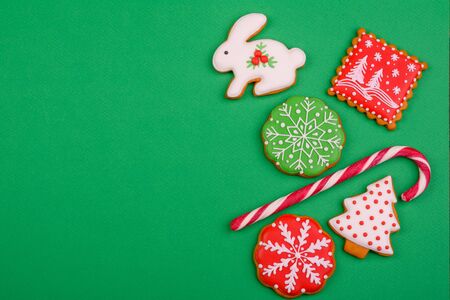 Christmas homemade gingerbread cookies on a bright colored background. New Year discount saleの写真素材