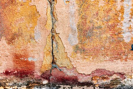 Wall fragment with scratches and cracks
