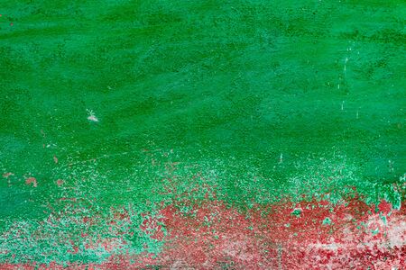 Texture of a concrete wall with cracks and scratches which can be used as a backgroundの写真素材