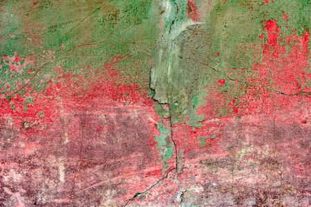 Texture of a concrete wall with cracks and scratches which can be used as a backgroundの写真素材