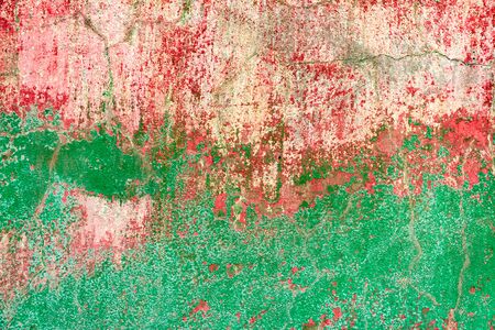 Texture of a concrete wall with cracks and scratches which can be used as a backgroundの写真素材