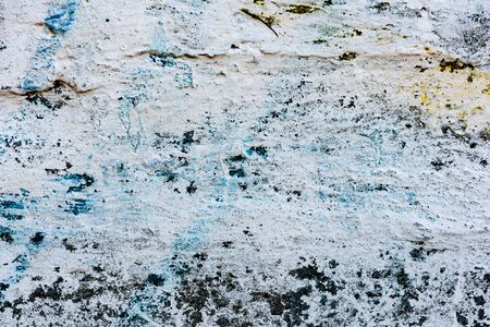 Texture of a concrete wall with cracks and scratches which can be used as a background