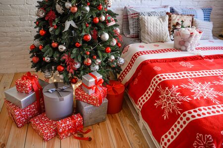 Christmas interior with gift boxes and Christmas fires. It can be used as a backgroundの写真素材