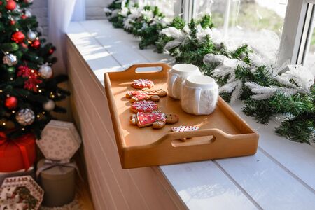 Christmas interior with gift boxes and Christmas fires. It can be used as a backgroundの写真素材