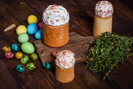 Easter cake and colorful eggs on a dark background. It can be used as a backgroundの写真素材