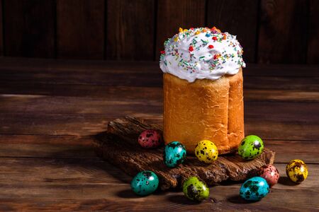 Easter cake and colorful eggs on a dark background. It can be used as a background