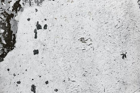 Texture of a concrete wall with cracks and scratches which can be used as a background