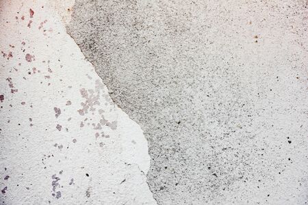 Texture of a concrete wall with cracks and scratches which can be used as a background
