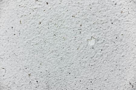 Texture of a concrete wall with cracks and scratches which can be used as a backgroundの写真素材