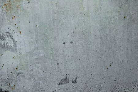 Texture of a concrete wall with cracks and scratches which can be used as a backgroundの写真素材