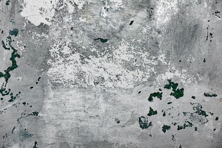 Texture of a concrete wall with cracks and scratches which can be used as a backgroundの写真素材