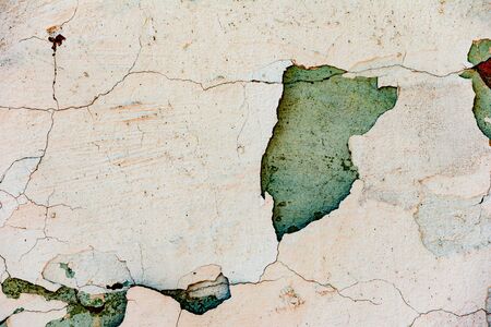 Texture of a concrete wall with cracks and scratches which can be used as a backgroundの写真素材