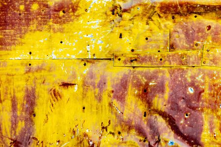 Metal texture with scratches and cracks which can be used as a backgroundの写真素材